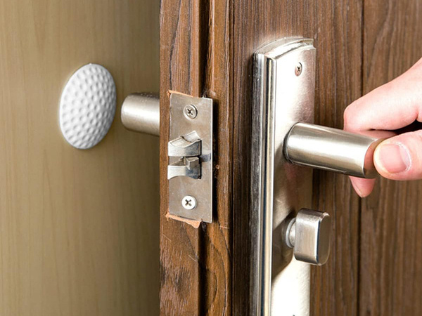 Door handle bumper self-adhesive to walls