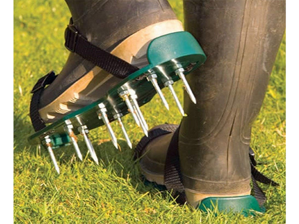 Garden aerator shoe covers large spikes for lawn aeration