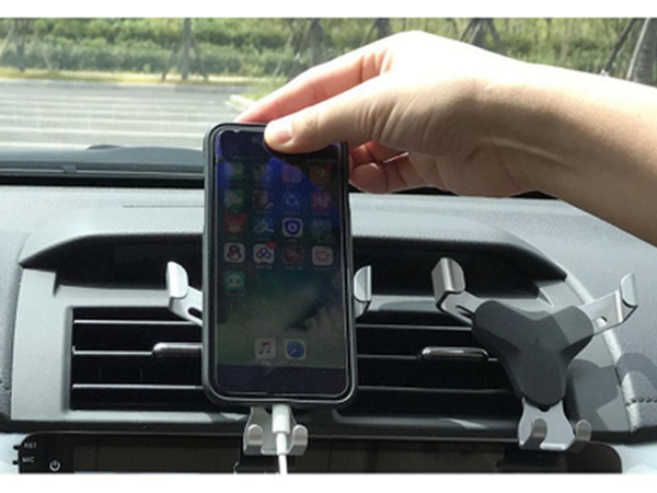 Gravity car holder for phone grille