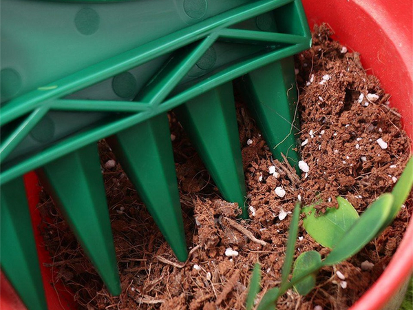 Hand-held 12-hole punch planter garden planter