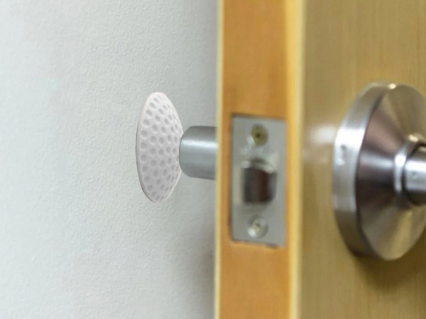 Door handle bumper self-adhesive to walls