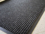 Rubberized doormat for shoes under the front door of the house 60 x 90