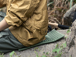 Foam folding hiking mat thermal seating carimata in the mountains