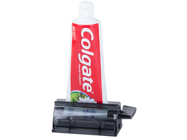 Stláčací dávkovač zubnej pasty v tube