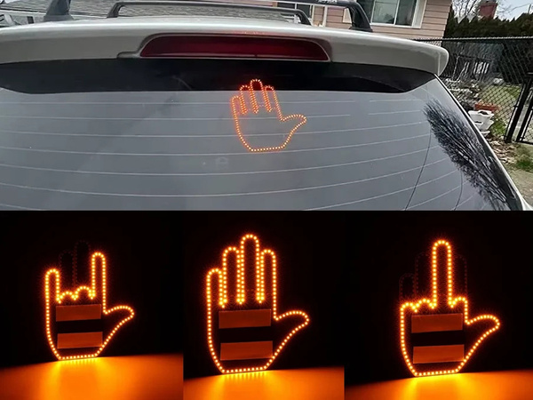 Gesture signalling hand on the rear window of a car middle finger led remote control