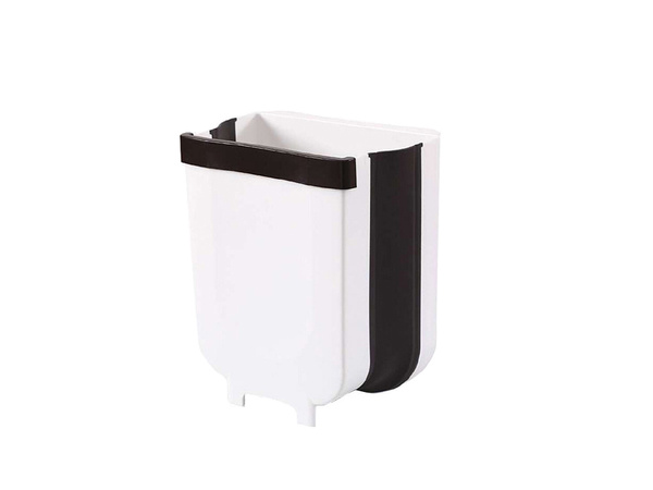 Salokāms grozs bioloģiskajiem atkritumiem, kas karājas uz skapja