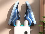 Wall-mounted shoe dryer with adhesive strips for intensive quick drying