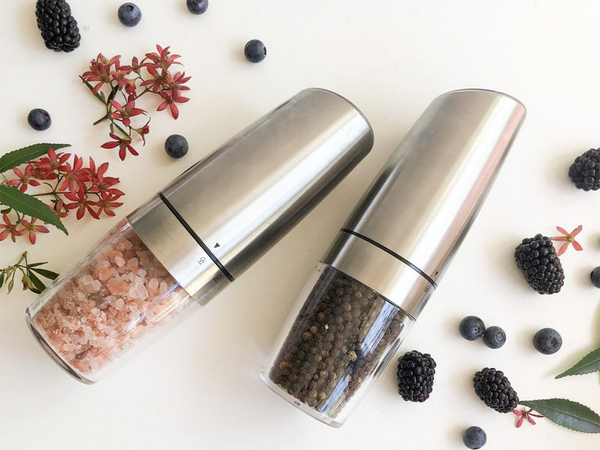 Electric gravity pepper and salt mill with lighting and adjustment