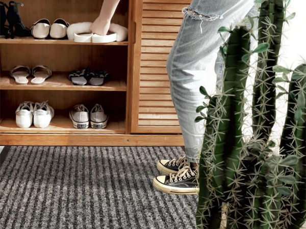 Rubberized doormat for shoes under the front door of the house 40 x 60