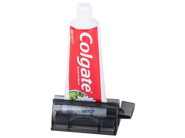 Dozirnik za zobno pasto v tubi s stiskalnikom