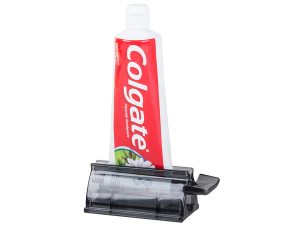 Dozirnik za zobno pasto v tubi s stiskalnikom